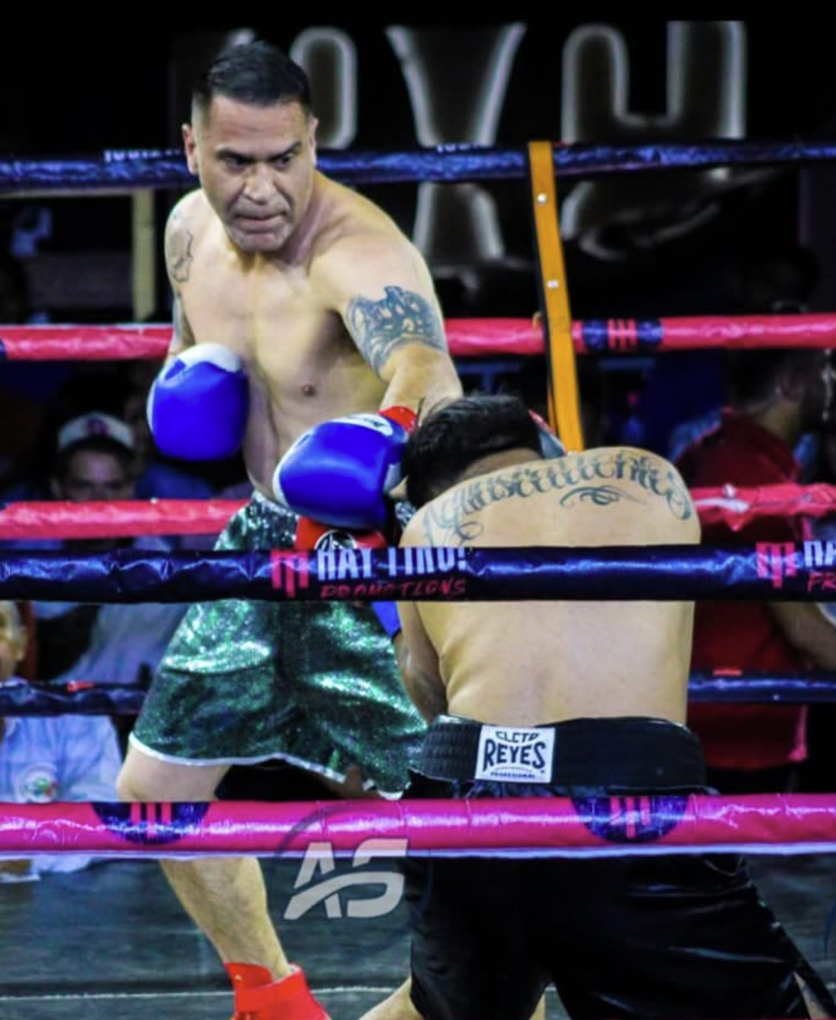 Coach Francisco competing in professional boxing match - Empire Boxing DFW trainer