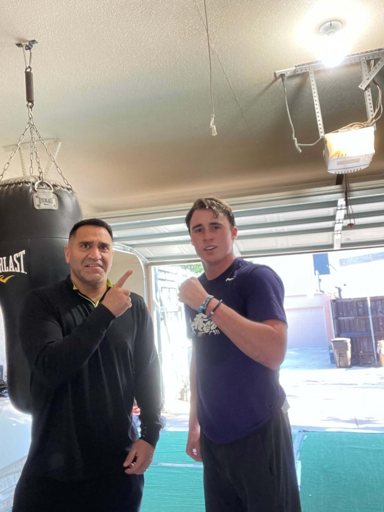 Coach Francisco with young fighter at Empire Boxing DFW private gym Plano